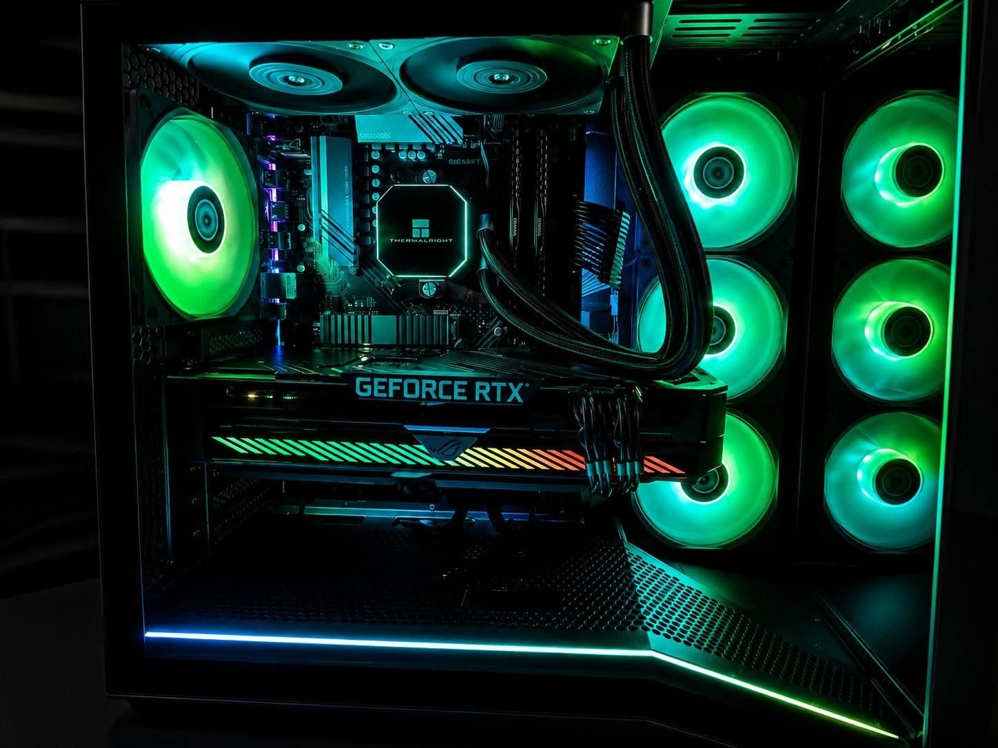 Custom gaming PC build with green RGB fans and GeForce RTX graphics card